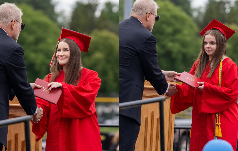 Ella Spuria and Katelyn Sarkis receive their diplomas | by Caden Crogan