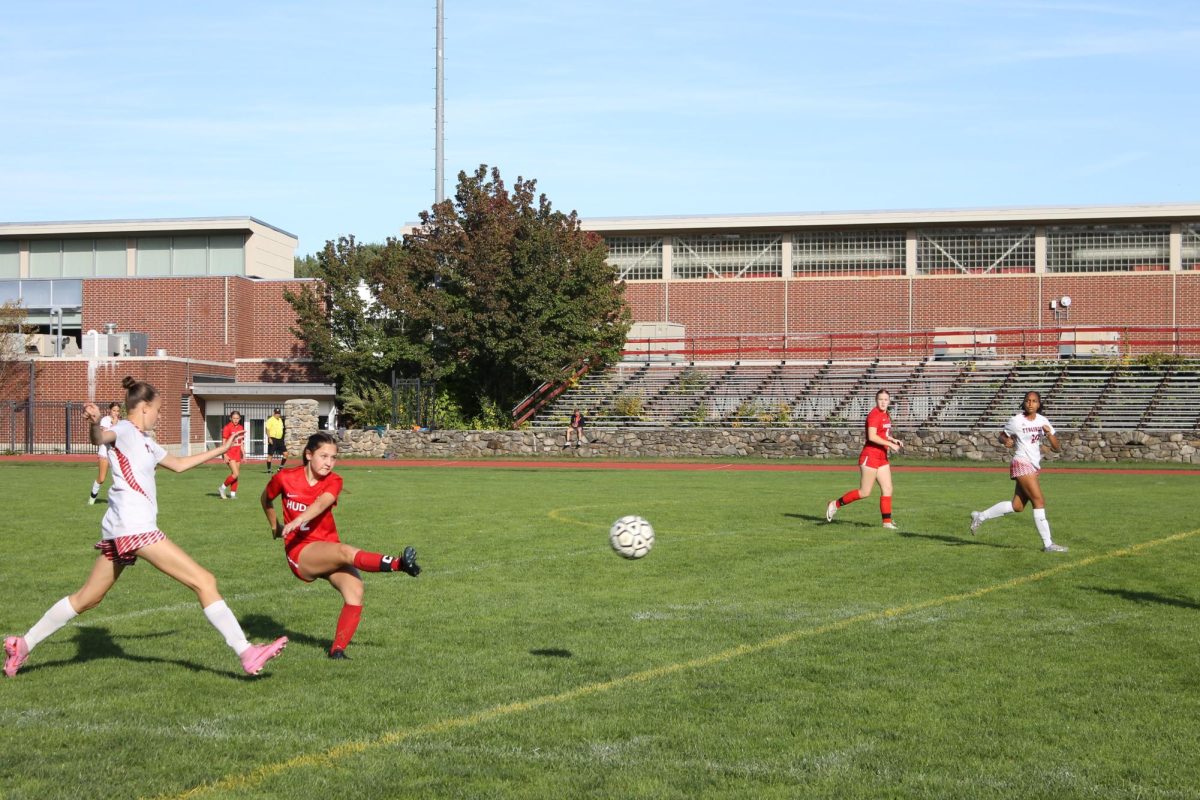 Senior Captain Makenna McGuire, 2 kicking the ball up the line 