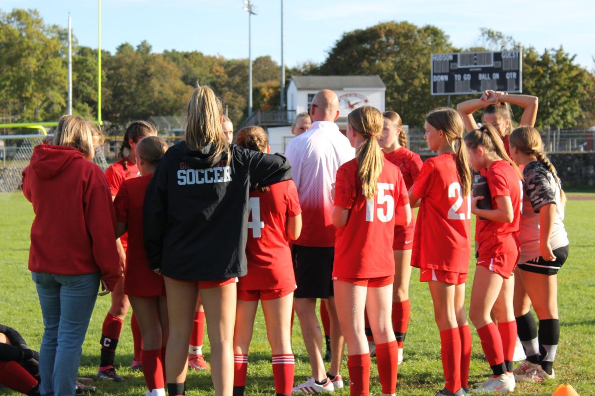 Coach Spencer Fortwengler saying inspirational words to team 