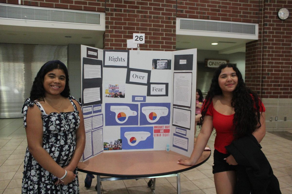 Kayleen Curtin Larissa Aguiar and  posing in front of poster | Daphney Da Costa 